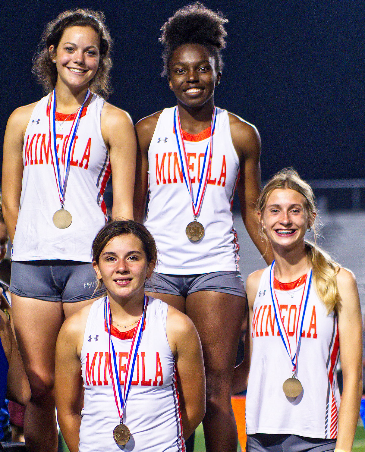 The Mineola state-qualifying relay team includes, clockwise from top left, Kozbie Riley, Shylah Kratzmeyer, Olivia Hughes and Carmen Carrasco.